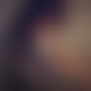 T.