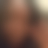 T.